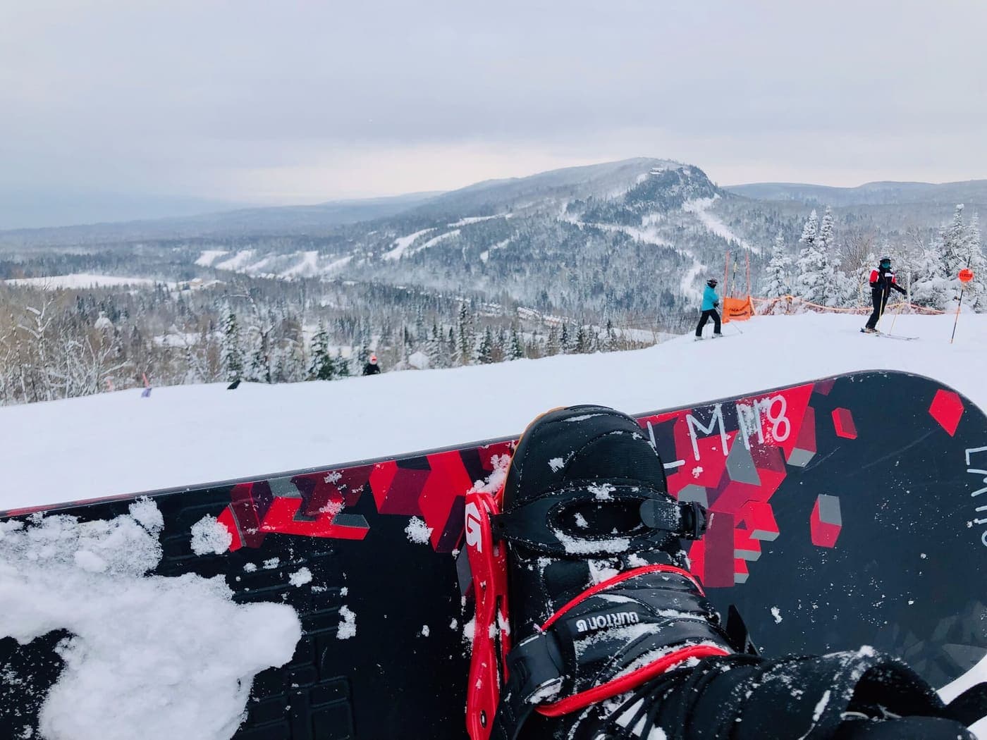 At the top of a snowboard run, looking out over a snowy valley